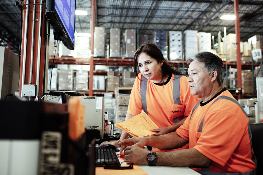 two employees at a warehouse