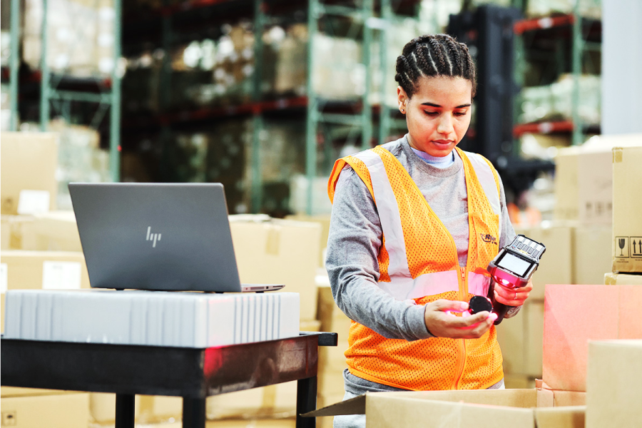 warehouse worker scanning RFID tag