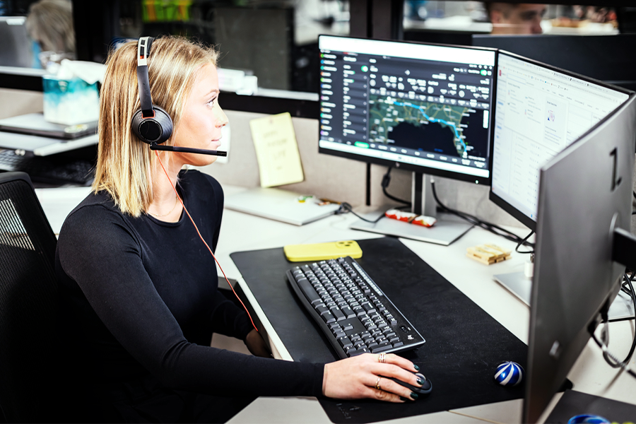 freight carrier support employee working at desk